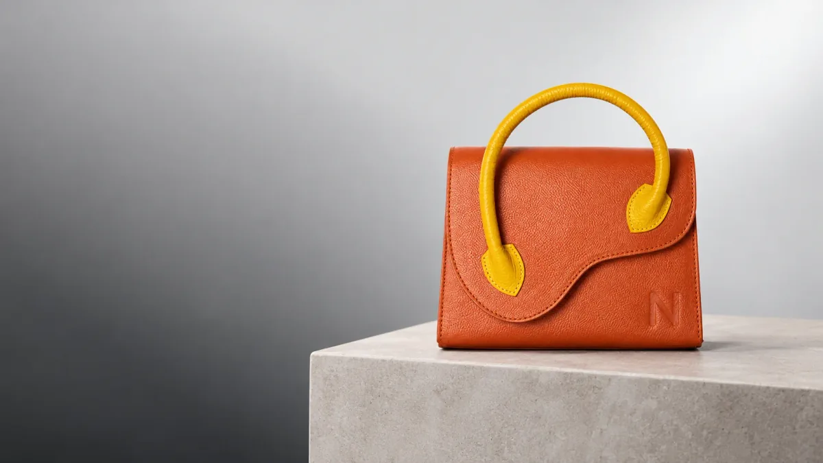 Nirvana orange Multi Diva crossbody with a sculptural yellow handle